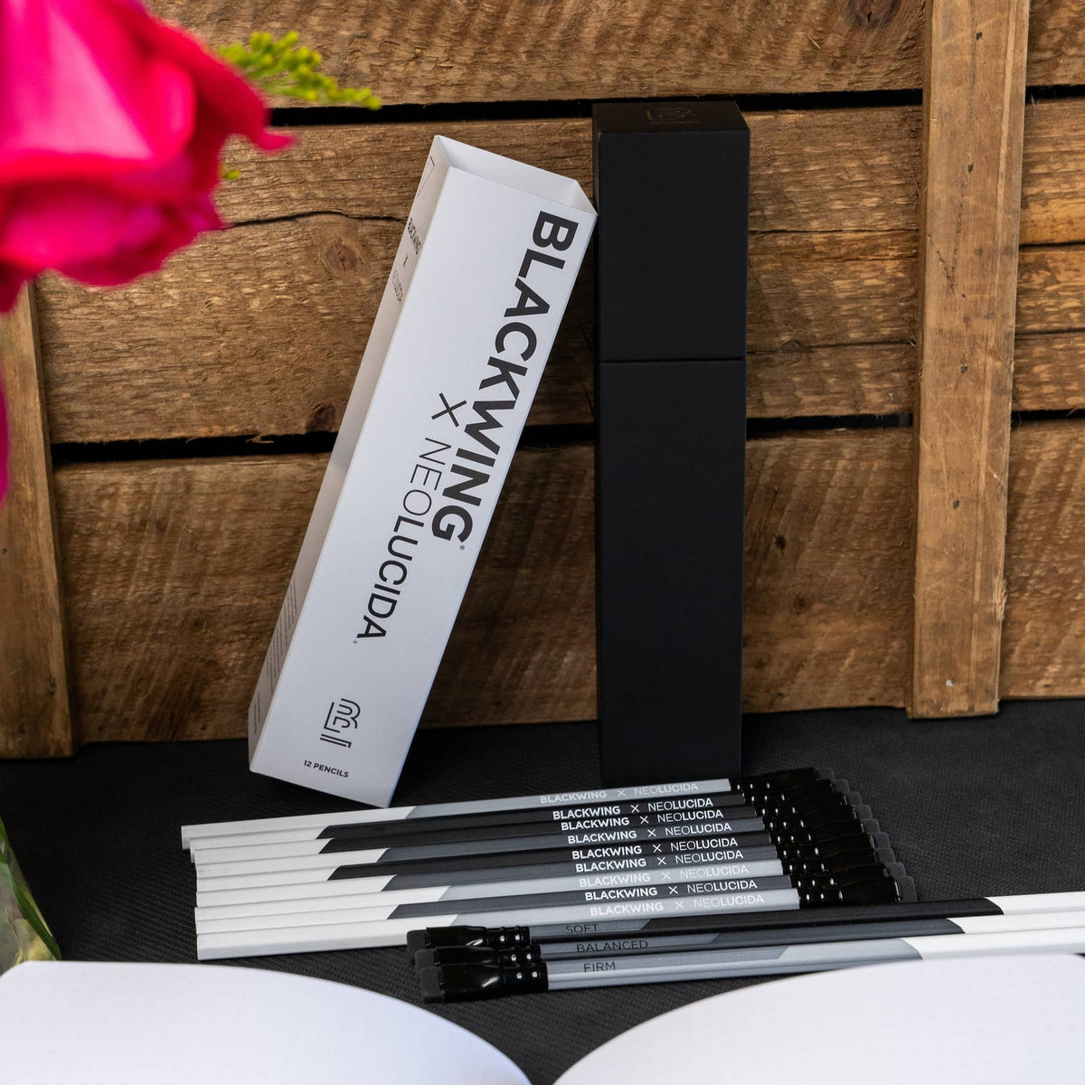 Box and black pencils from BIG IDEA DESIGN LLC showing Blackwing Neolucida pencils arranged on a wooden surface