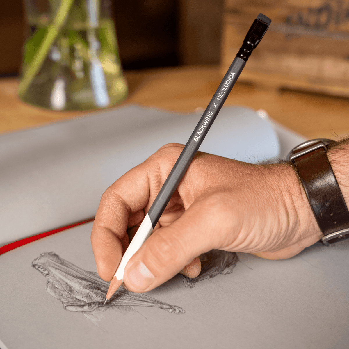 Person drawing a detailed sketch using Blackwing Neolucida pencils by BIG IDEA DESIGN LLC