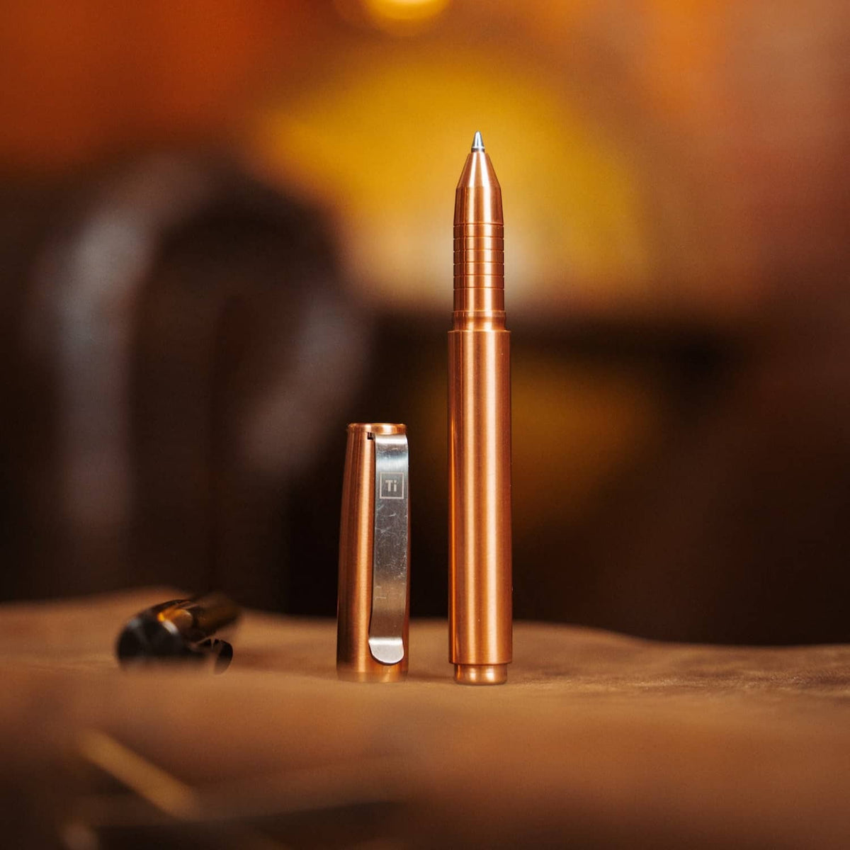 Copper titanium capped pen by BIG IDEA DESIGN LLC with sleek metal finish and clip